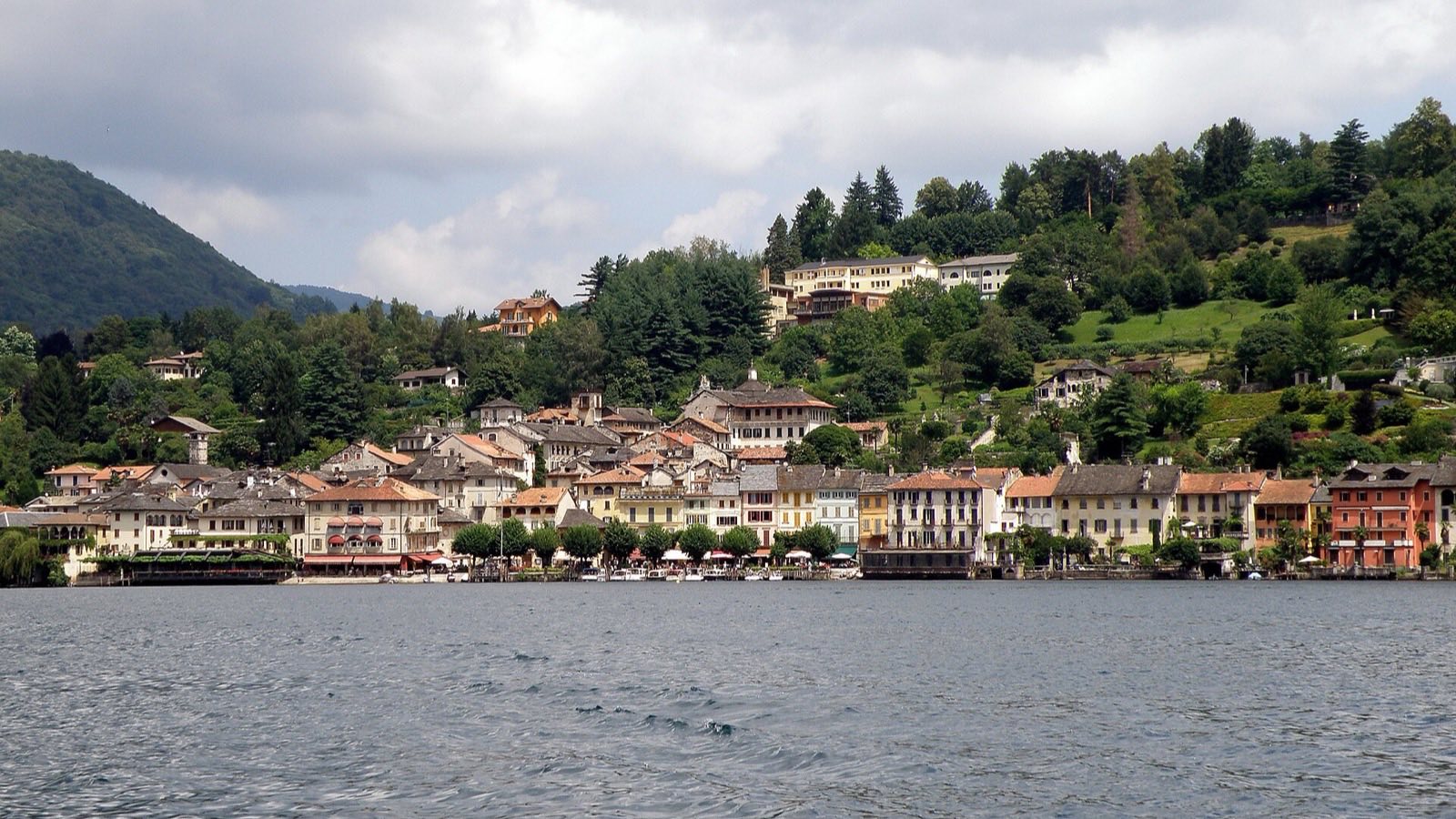 Orta San Giulio seen from the water under a grey autumn sky