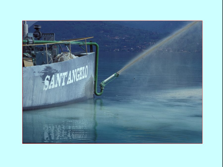 The barge Sant'Angelo spraying a slurry of powdered limestone onto the surface of Lake Orta during the liming operation in 1989-1990
