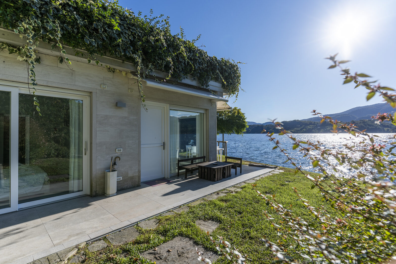 Terrace with sliding doors and lake view